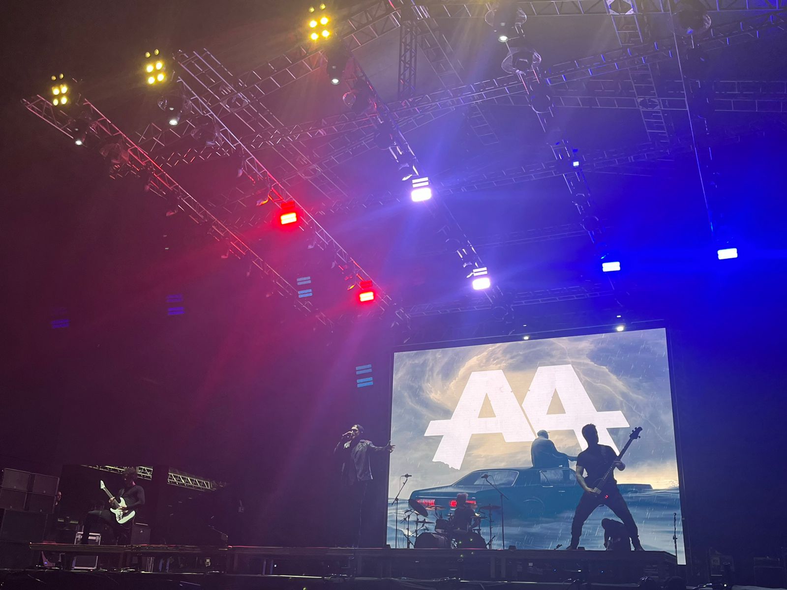 A live music performance with stage lighting captures the energy of conversation.